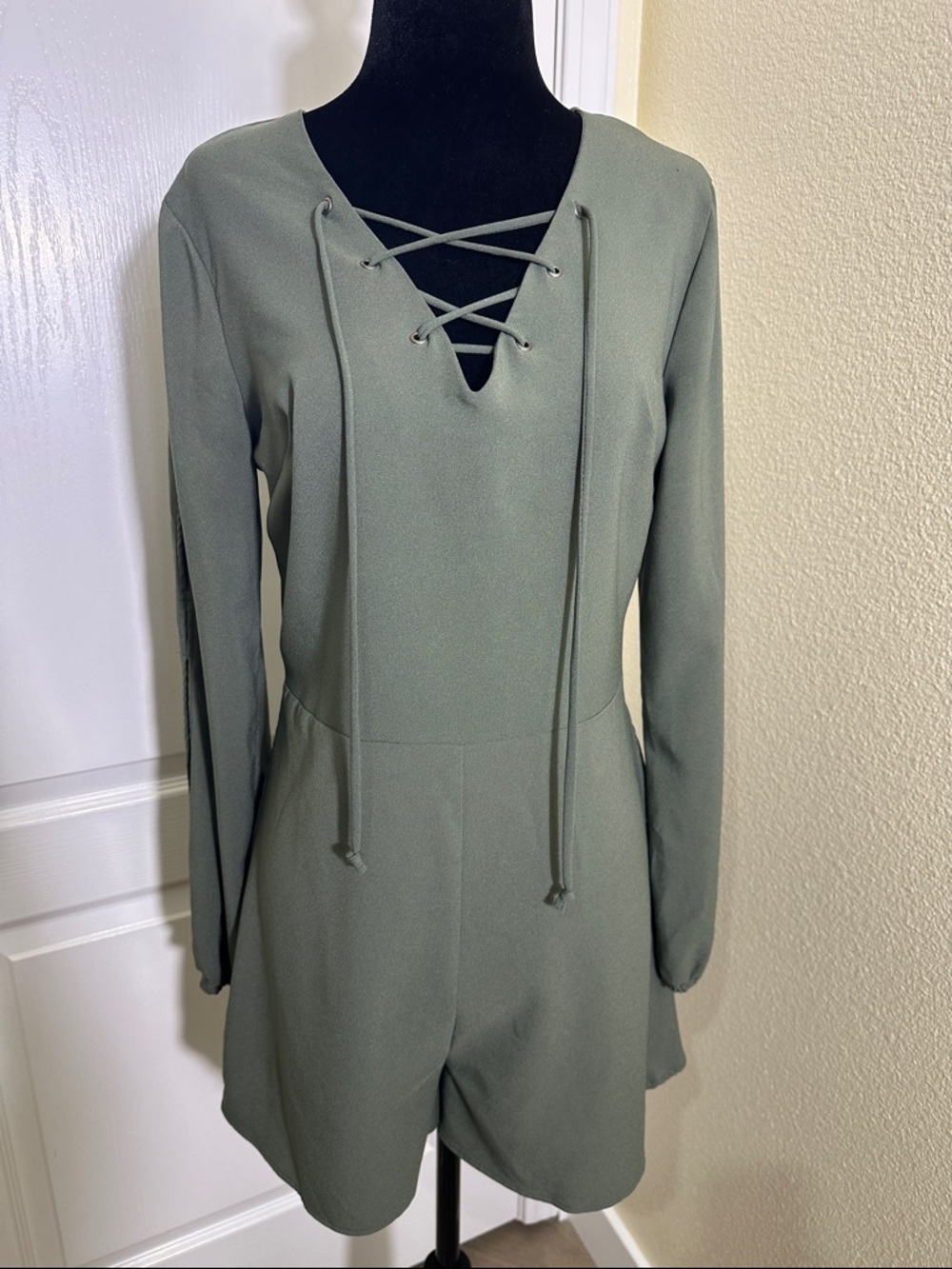 Olive Green Lace-Up Long Sleeve Romper with split sleeves. Medium.